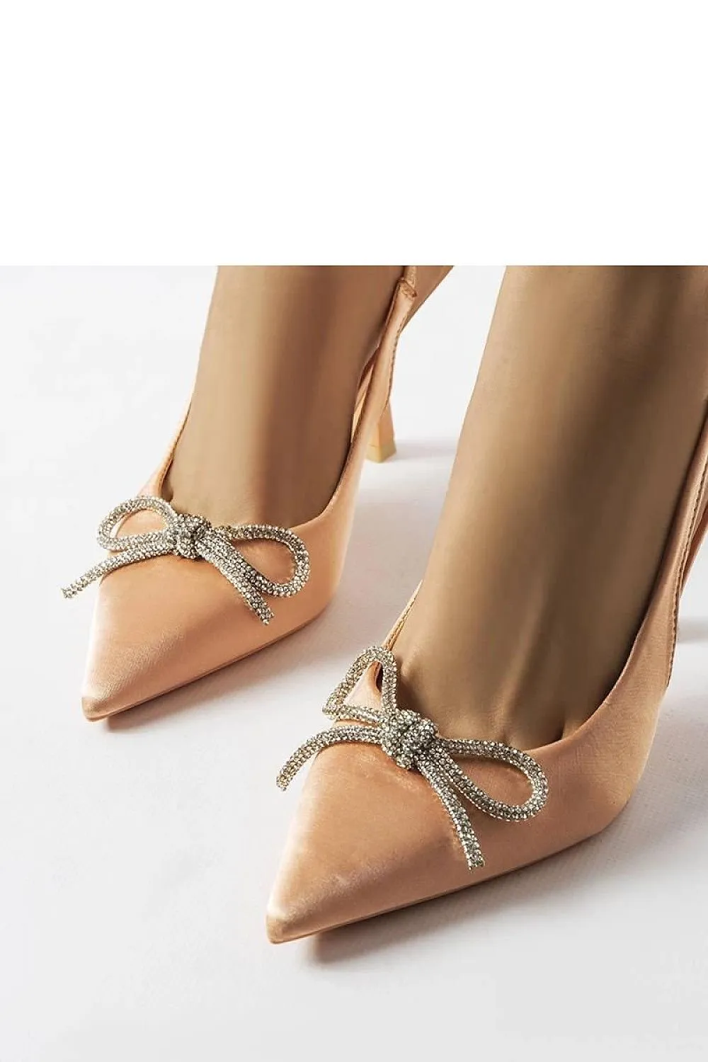 Elegant stylish beige heels with a bow